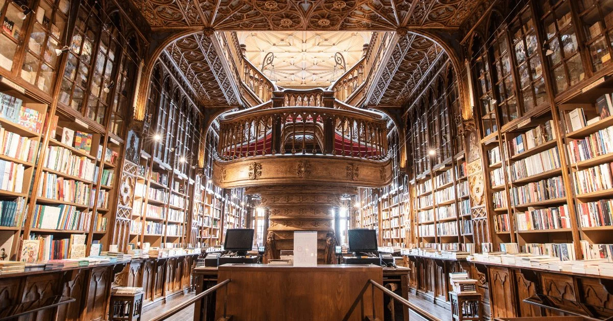 Large library with wooden bookshelves on two levels